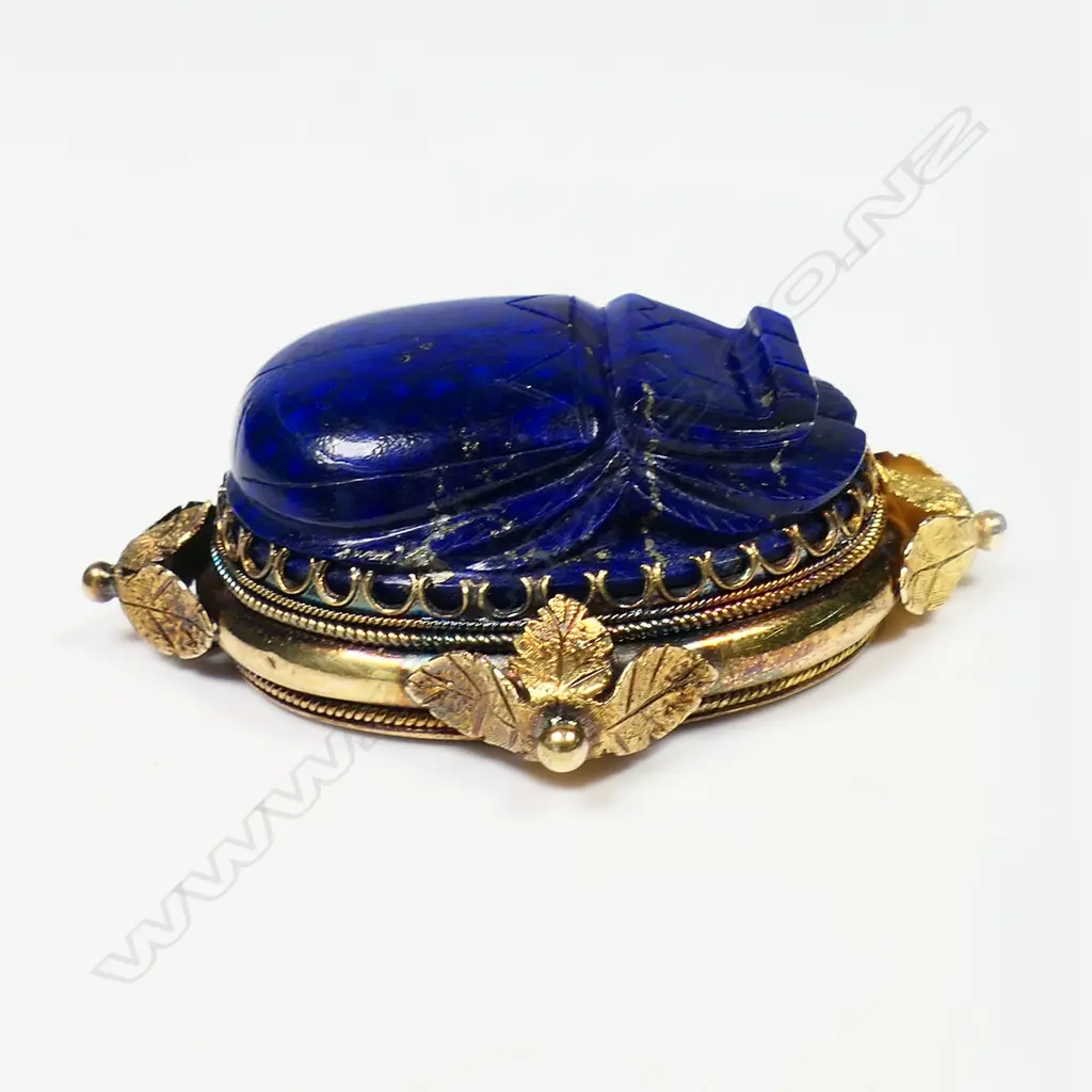 An impressive 18ct gold antique lapis lazuli scarab beetle ring and brooch - both multi claw set in ornate decorative frames. The ring on a later 15ct gold shank. The brooch's fitting absent. Image 1++