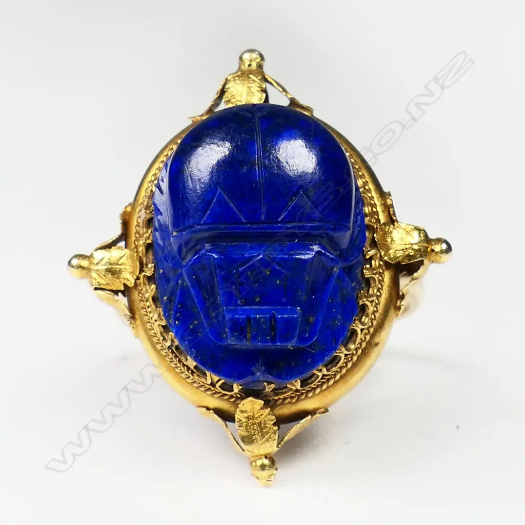 An impressive 18ct gold antique lapis lazuli scarab beetle ring and brooch - both multi claw set in ornate decorative frames. The ring on a later 15ct gold shank. The brooch's fitting absent. Image 1++