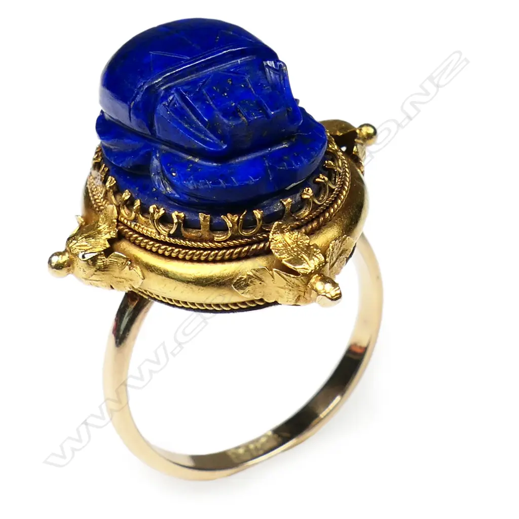 An impressive 18ct gold antique lapis lazuli scarab beetle ring and brooch - both multi claw set in ornate decorative frames. The ring on a later 15ct gold shank. The brooch's fitting absent. Image 1++
