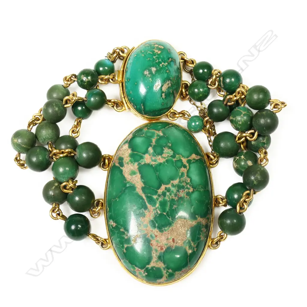 A 14ct gold and spiderweb variscite bracelet - a large oval variscite cabochon bezel set, with three gold chain and variscite bead strands connected to a push clasp set with a smaller oval variscite cabochon. Not marked but tests as 14ct. Image 1++