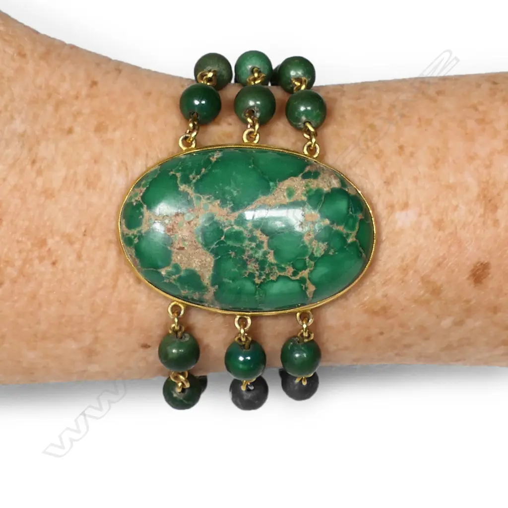 A 14ct gold and spiderweb variscite bracelet - a large oval variscite cabochon bezel set, with three gold chain and variscite bead strands connected to a push clasp set with a smaller oval variscite cabochon. Not marked but tests as 14ct. Image 1++