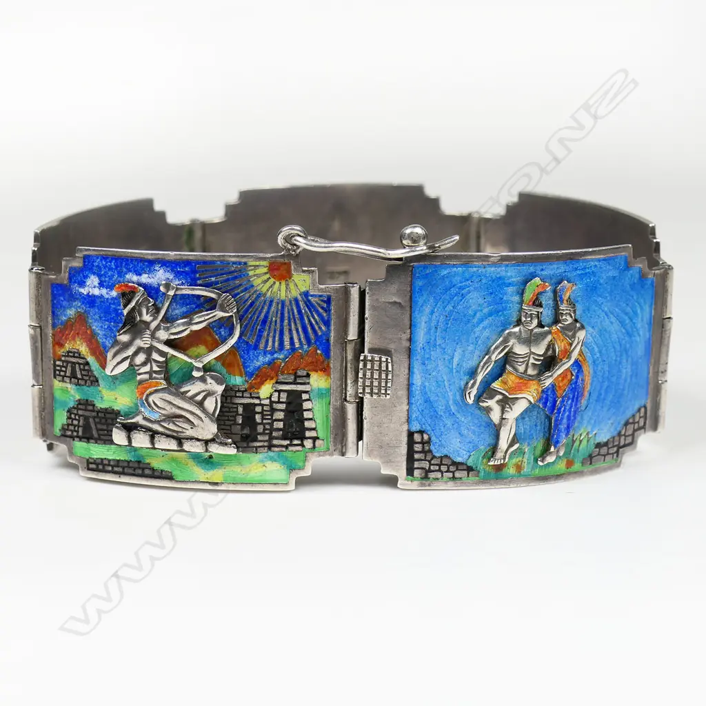 A good Art Deco Aztec enamelled silver scenic bracelet - the five shaped panels each of a various multicoloured scene including applied figures adoring the sun and other historic narratives. 60gms. Image 1++