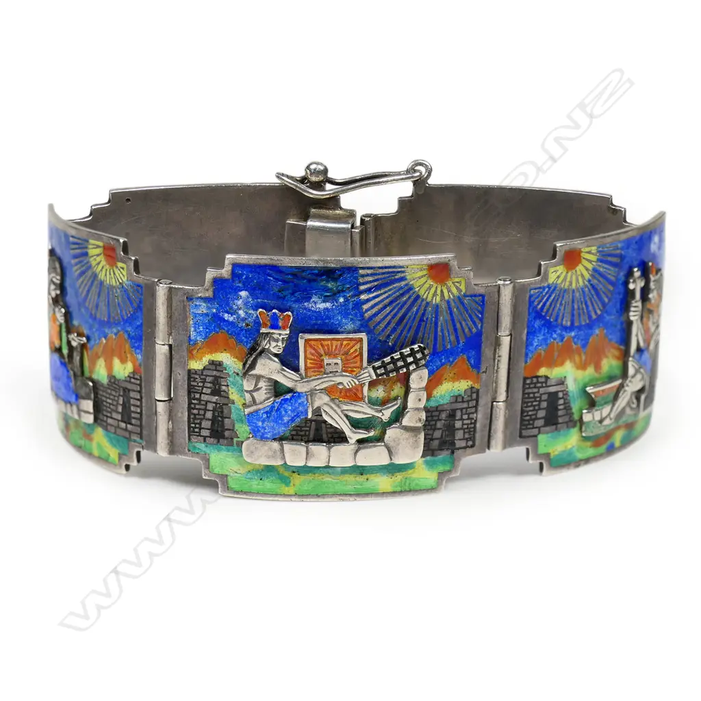 A good Art Deco Aztec enamelled silver scenic bracelet - the five shaped panels each of a various multicoloured scene including applied figures adoring the sun and other historic narratives. 60gms. Image 1++