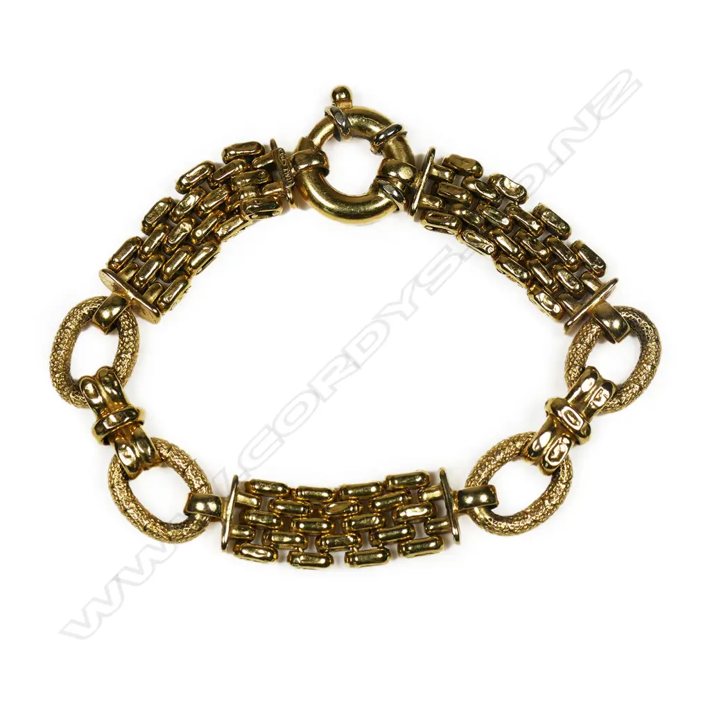 An 18ct gold designer bracelet - multiple articulated fancy links, with large spring clasp. Stamped Italy. 21.39gms. Image 1++