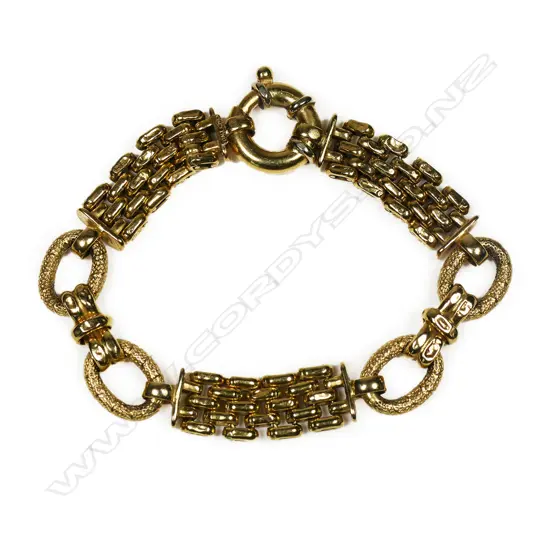 An 18ct gold designer bracelet - multiple articulated fancy links, with large spring clasp. Stamped Italy. 21.39gms.