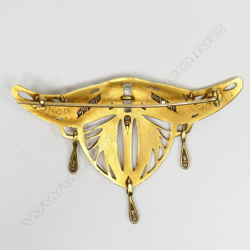 A rare 'Gonon' French Art Nouveau 18ct yellow gold diamond and pearl stylish brooch - of winged form with wheat sheath open decoration highlighted with 21 rose cut diamonds, set in white gold, including nine to the three pendant drops, and a single cultured pearl. The reverse stamped 'GONON PARIS 1912'. W.74mm. 19.2gms. Image 1++