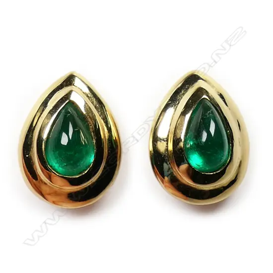 A pair of 18ct gold and emerald stud earrings - the pear shaped emerald cabochons in a substantial gold rub over mount. Posts for pierced ears.