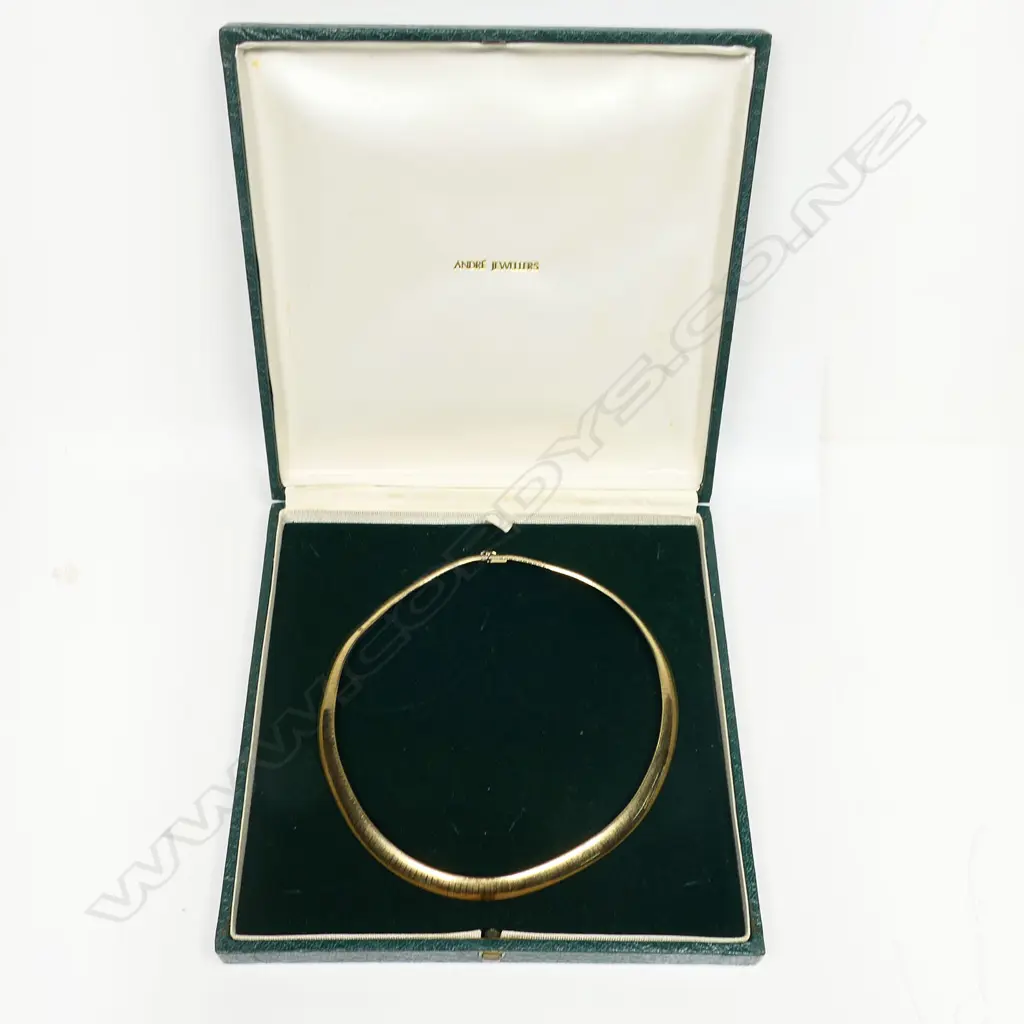 A 9ct gold choker - graduating flat articulated links, push clasp with safety catch. 46.73gms. Valuation available. Image 1++