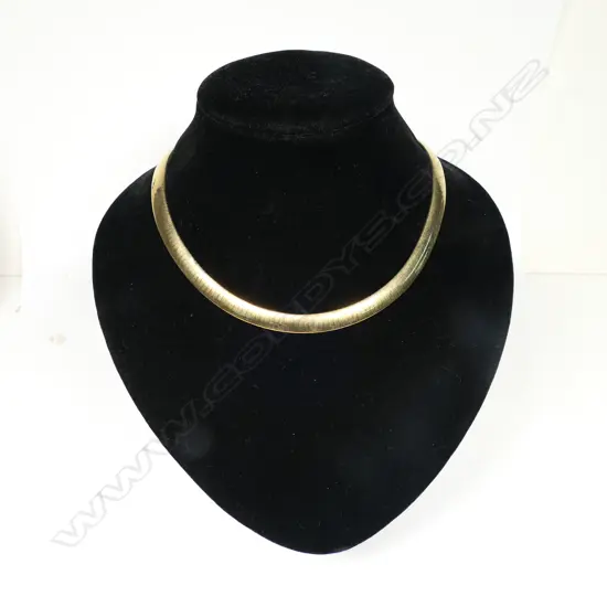 A 9ct gold choker - graduating flat articulated links, push clasp with safety catch. 46.73gms. Valuation available.