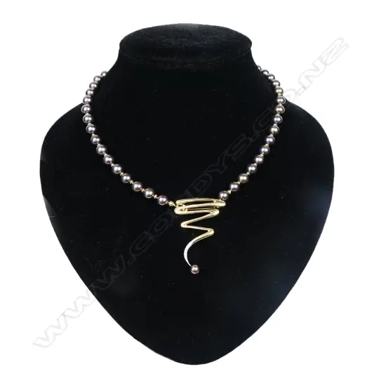 Tahitian pearl 14ct gold and diamond necklace - of 48 round Tahitian pearls of purple grey tone and diameter 5.7mm to 7.4mm with a central 14ct yellow gold detachable pendant brooch set with eight round brilliant cut diamonds. 21 'gold' spacers between the pearls. 18ct gold clasp. L.400mm. Valuation available.