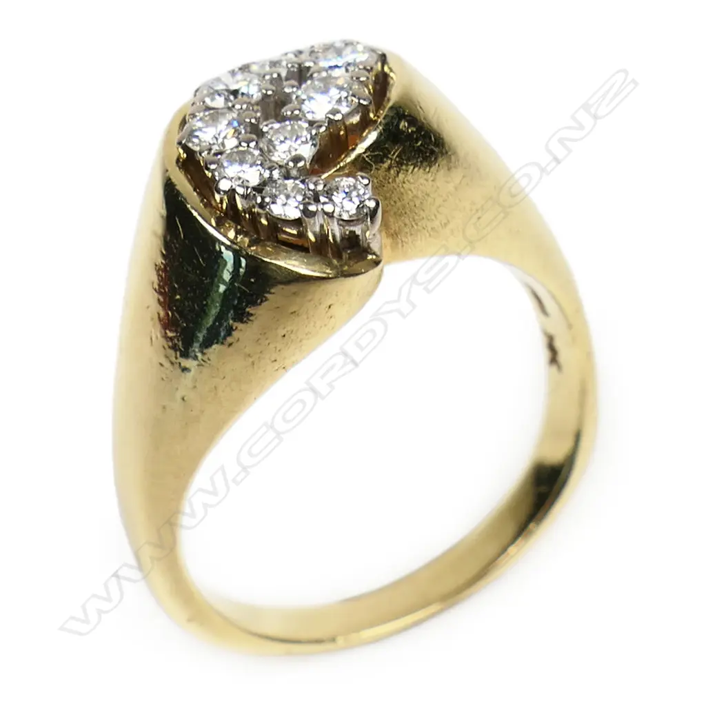 An estate heavy18ct yellow gold and diamond cluster ring - the 12 round brilliant cut diamonds claw set in white gold pillars in a cross-over setting. Wide tapered shoulders, 11.2gms. Valuation available. Image 1++