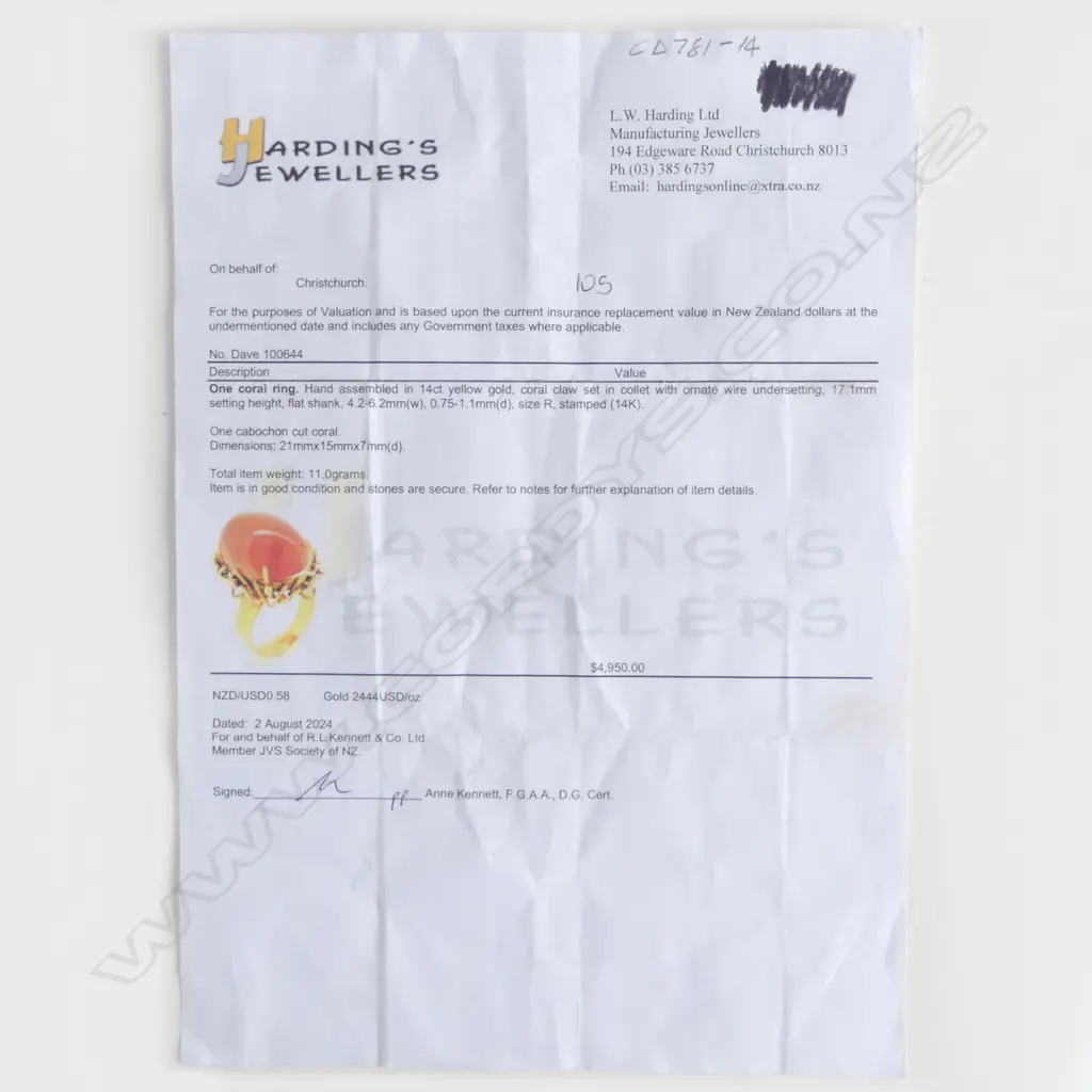 A vintage 14ct yellow gold and coral ring - the large oval orange / red coral cabochon claw set in collet with ornate wire undersetting. 11gms. Valuation available. Image 1++