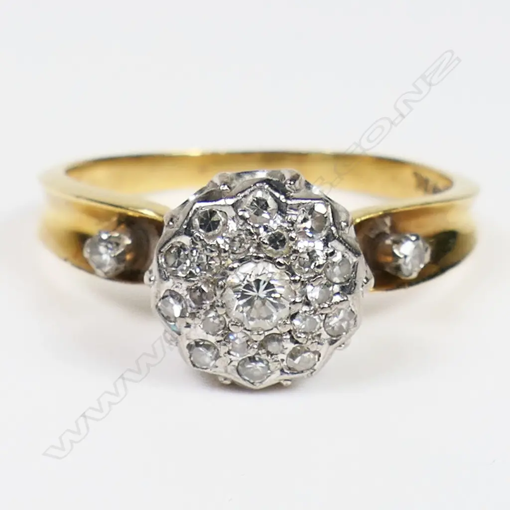An 18ct yellow gold and platinum diamond cluster ring - twenty-three round brilliant cut and single cut diamonds (Colour I-K, Clarity SI1-P1) set in a cluster, with a single cut diamond to each shoulder. TDW. 0.51ct. Ring size M. Image 1++