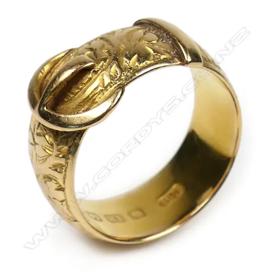 An Edwardian 18ct gold engraved buckle ring - a good heavy wide example in good condition. 4.15gms. Birmingham 1906