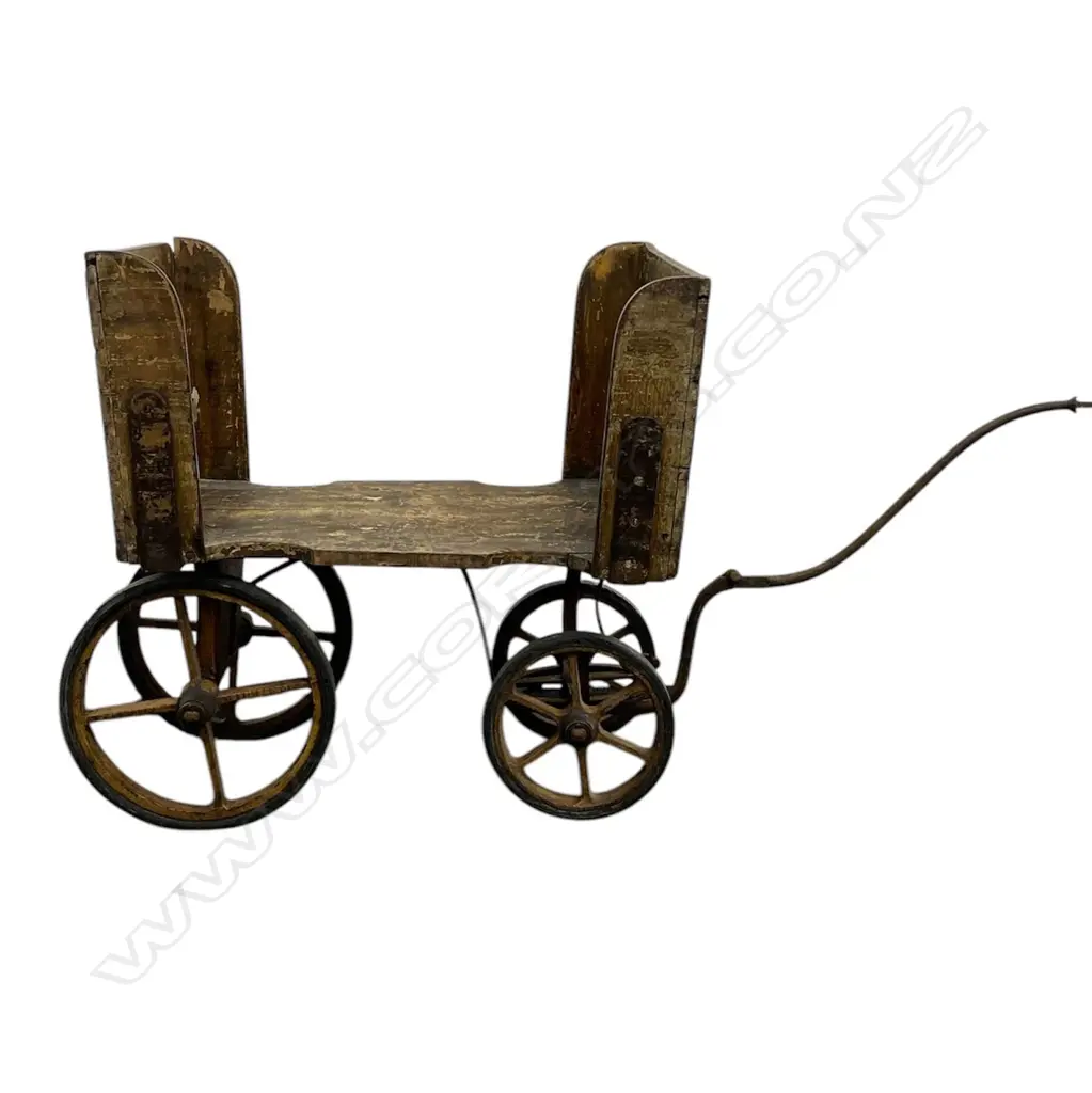 An early 1900s wooden library trolley - open sides on cast iron base and wheels, with remains of old paper and paint finish, gilt 'Signature Books' lettered to the front. 1400 x 540 x 800mm. Image 1++