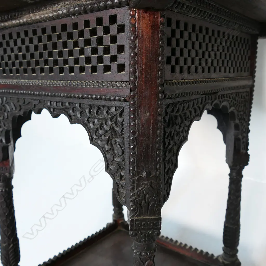 An Anglo Indian rosewood side table - profusely carved with flowering vines, wild animals and dancing figures, carved apron, legs and shelf to base. 610 x 610 x 620mm. Image 1++