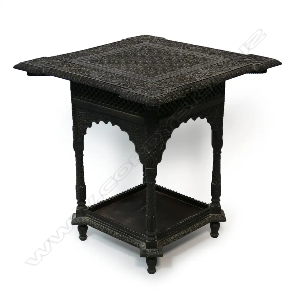 An Anglo Indian rosewood side table - profusely carved with flowering vines, wild animals and dancing figures, carved apron, legs and shelf to base. 610 x 610 x 620mm. Image 1++