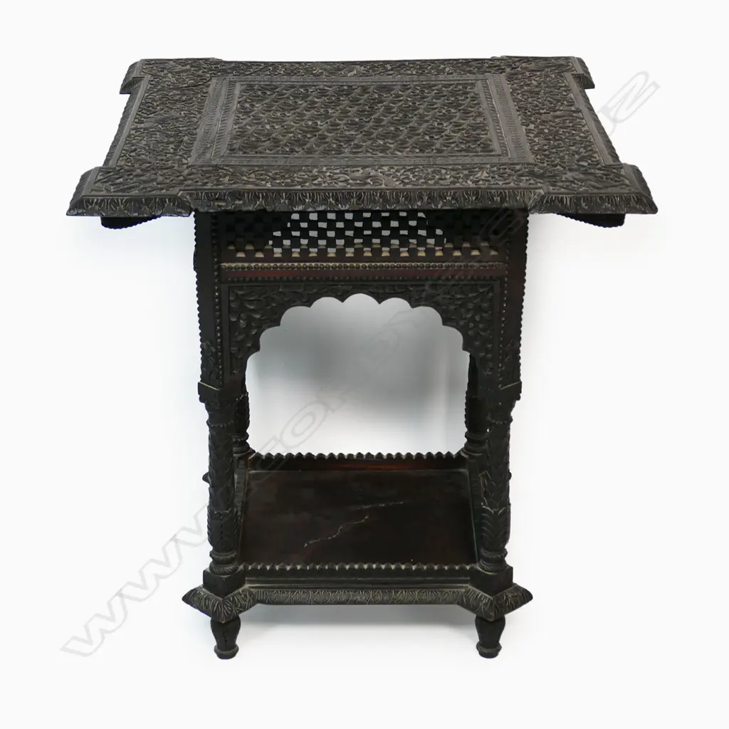An Anglo Indian rosewood side table - profusely carved with flowering vines, wild animals and dancing figures, carved apron, legs and shelf to base. 610 x 610 x 620mm. Image 1++