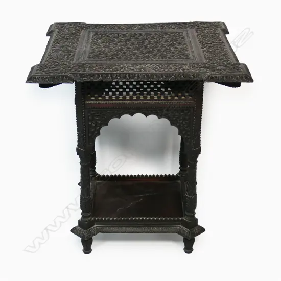 An Anglo Indian rosewood side table - profusely carved with flowering vines, wild animals and dancing figures, carved apron, legs and shelf to base. 610 x 610 x 620mm.