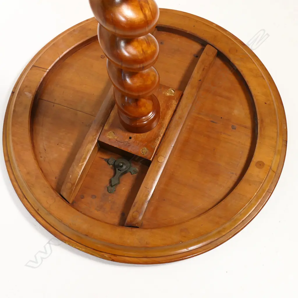 Anton Seuffert (1815-1887 New Zealand) fine and rare tilt-top specimen card table - the top with central multi-pointed starburst originating from a six-pointed star, on a fine rewarewa parquetry ground with traditional Seuffert scalloped border. The inlay of various N.Z. native timbers. On mottled Kauri tapering barley twist stem and three scroll legs. Dia.555mm. H.760mm. Image 1++