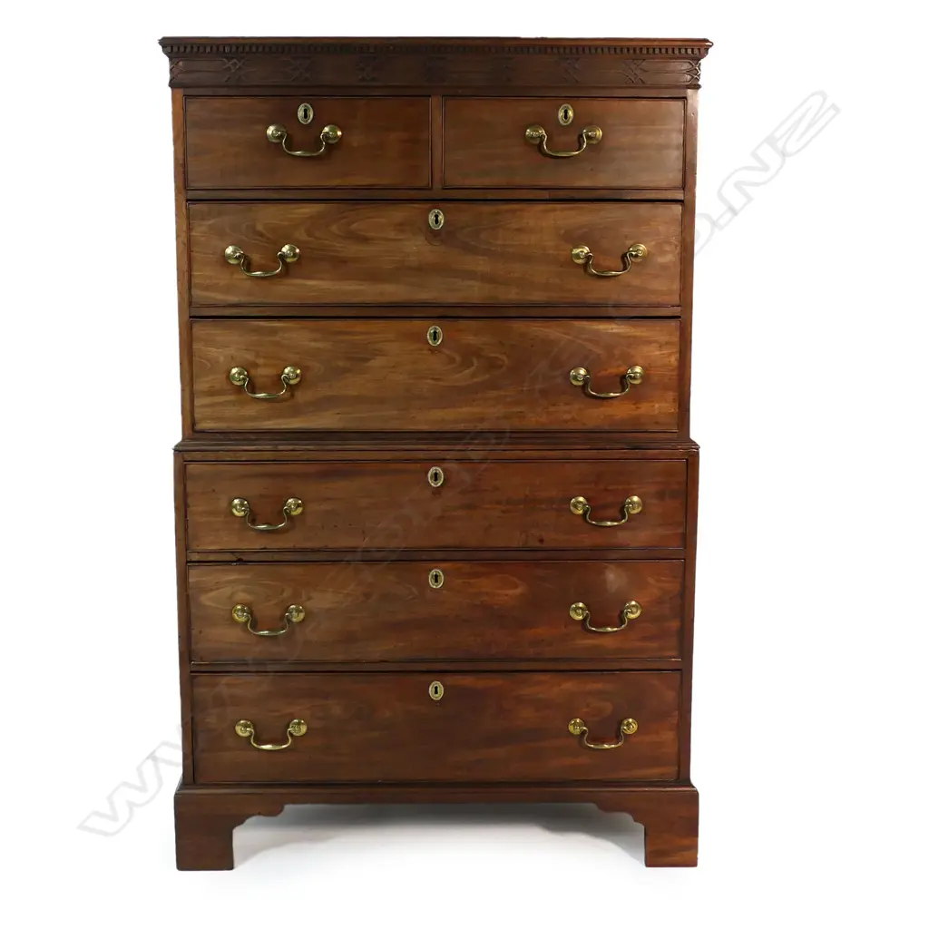 A Georgian mahogany chest on chest - the top of two half and two full width drawers, with fret work decoration to pediment, the base with three full width drawers, raised on bracket feet. 1030 x 540 x 1680mm. Image 1++