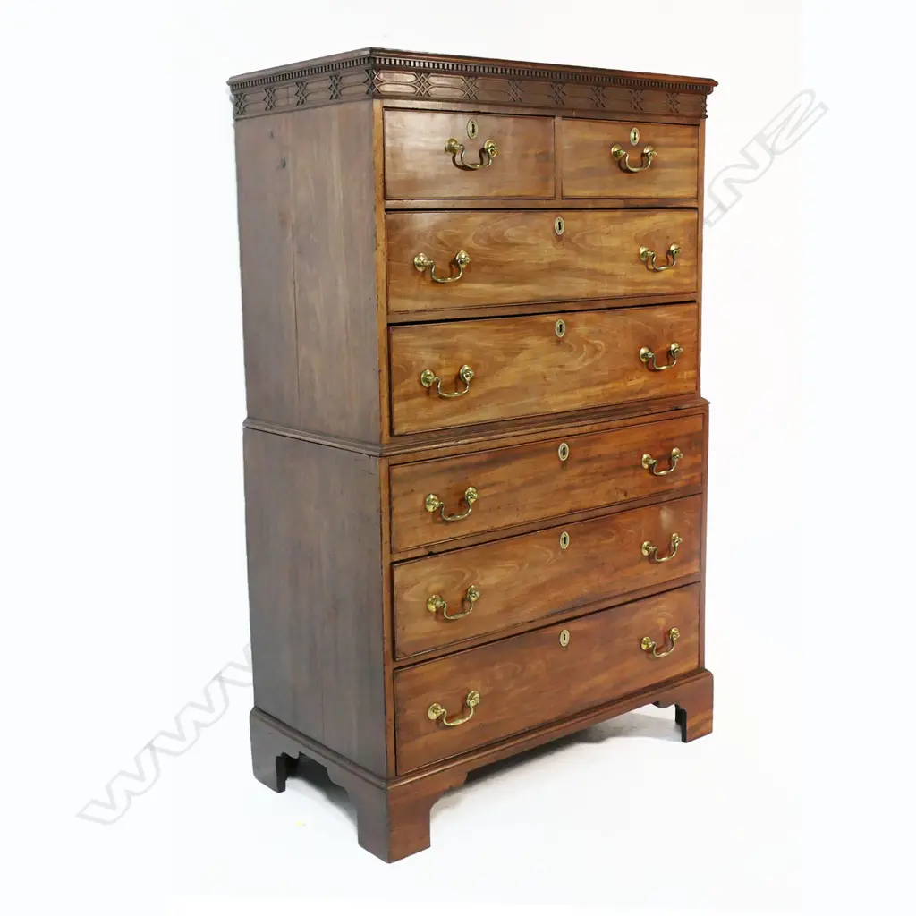 A Georgian mahogany chest on chest - the top of two half and two full width drawers, with fret work decoration to pediment, the base with three full width drawers, raised on bracket feet. 1030 x 540 x 1680mm. Image 1++