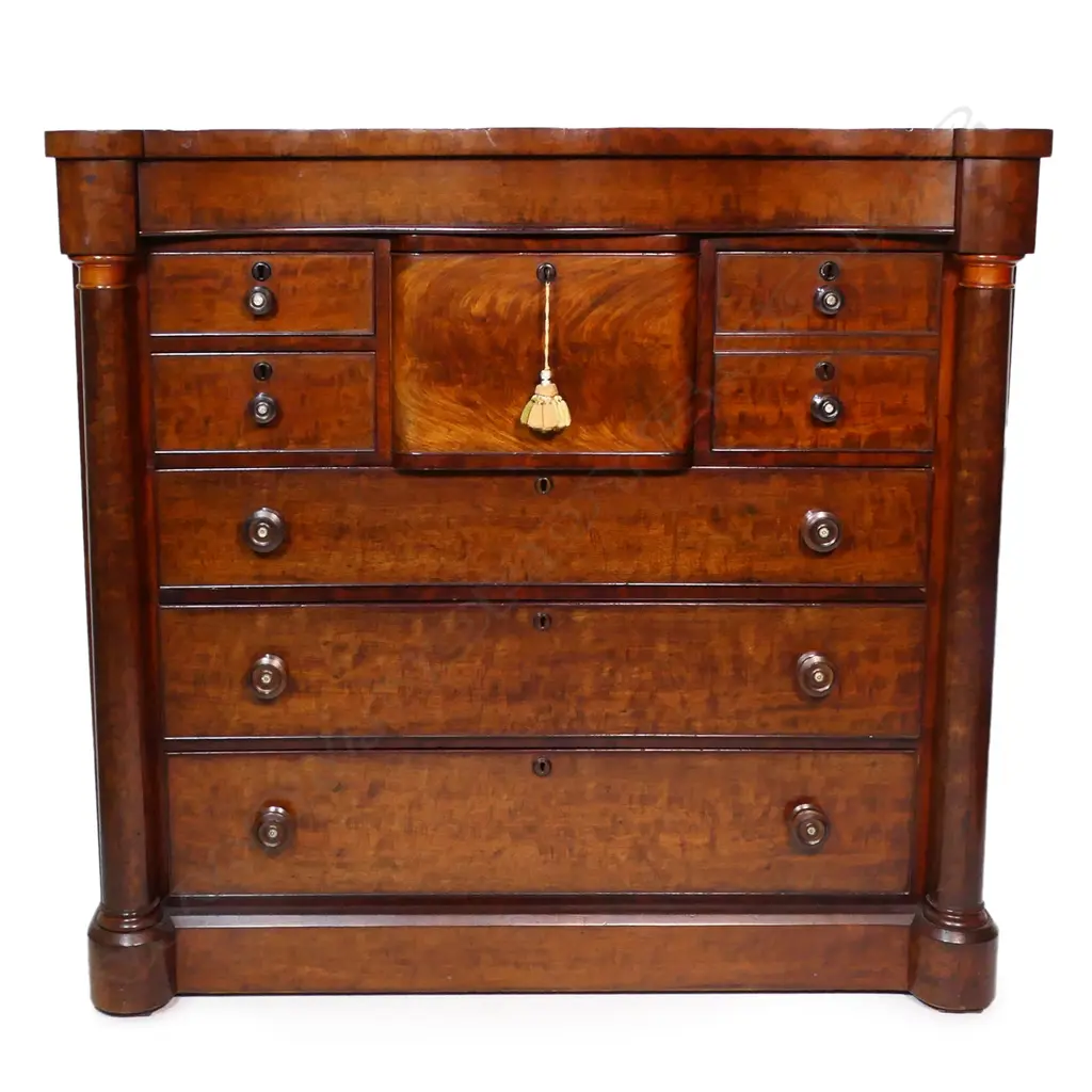 An impressive Victorian flame mahogany scotch chest - serpentine shape top, with secret frieze drawer, two hat box drawers and two half drawers over three full width drawers, pillars to each side, raised on plinth base. 1290 x 600 x 1185mm. Image 1++