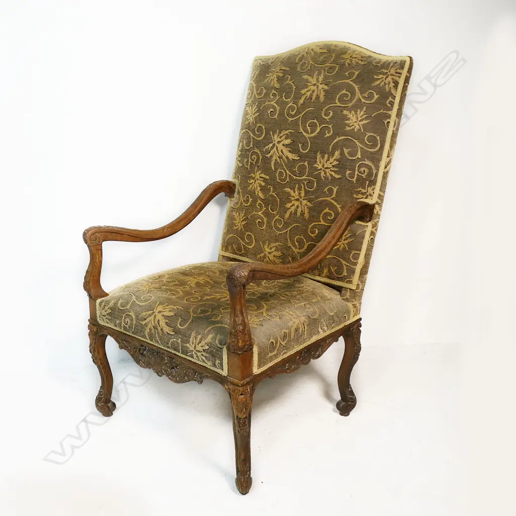 A 19thC oak baronial chair - carved oak frame upholstered in a self-patterned fabric. 730 x 800 x 1200mm. Image 1++
