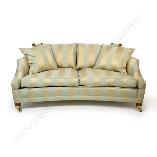 A Duresta designer 'Hornblower; two seater Knole sofa - upholstered in a striped muted gold and light teal fabric, with conforming wood and cord tassels, with separate cushions and substantial brass casters. Provenance: Purchased from Baran de Bourdeaux Fine Antiques. This piece has been in storage for a number of years. 1800 x 1160 x 900mm.