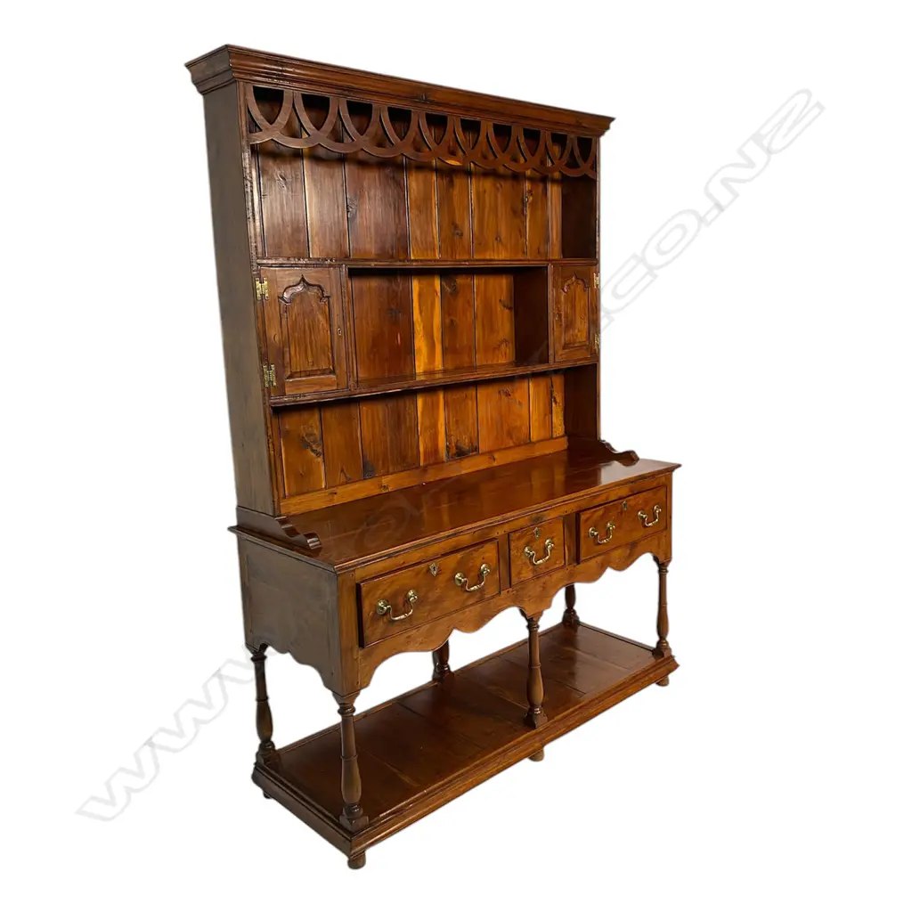 A quality George III style solid yew wood decorative plate rack back dresser - the back with over-looping frieze above two shelves and two small cupboards. The base with three frieze drawers and turned supports above the panelled lower shelf base. Traditionally made with some pegged construction. Oak lined. In good polish. 1360 x 470 x 1880mm. Image 1++