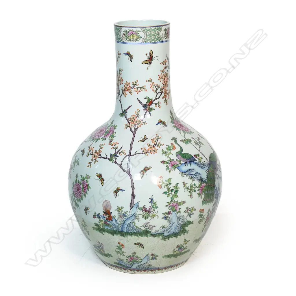 A large and impressive Chinese porcelain famille rose floor standing vase - the wide spherical body and cylindrical neck in all over famille rose decoration including birds, butterflies and florals. H.830mm. Image 1++