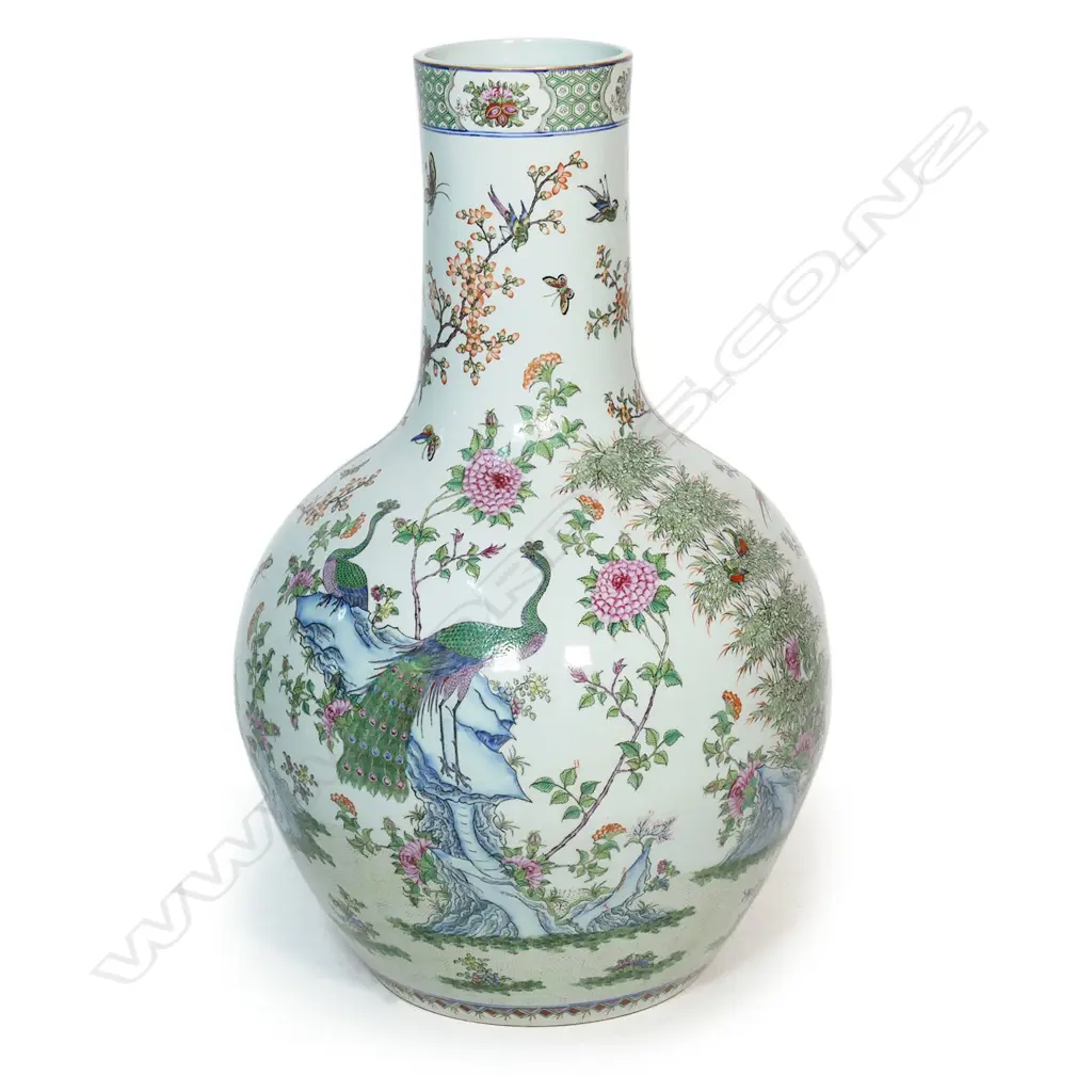 A large and impressive Chinese porcelain famille rose floor standing vase - the wide spherical body and cylindrical neck in all over famille rose decoration including birds, butterflies and florals. H.830mm. Image 1++