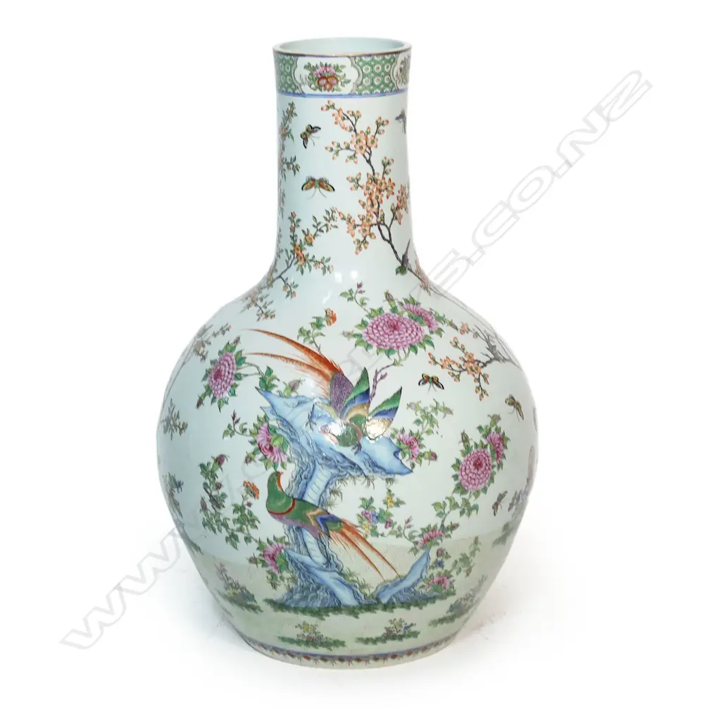 A large and impressive Chinese porcelain famille rose floor standing vase - the wide spherical body and cylindrical neck in all over famille rose decoration including birds, butterflies and florals. H.830mm. Image 1++