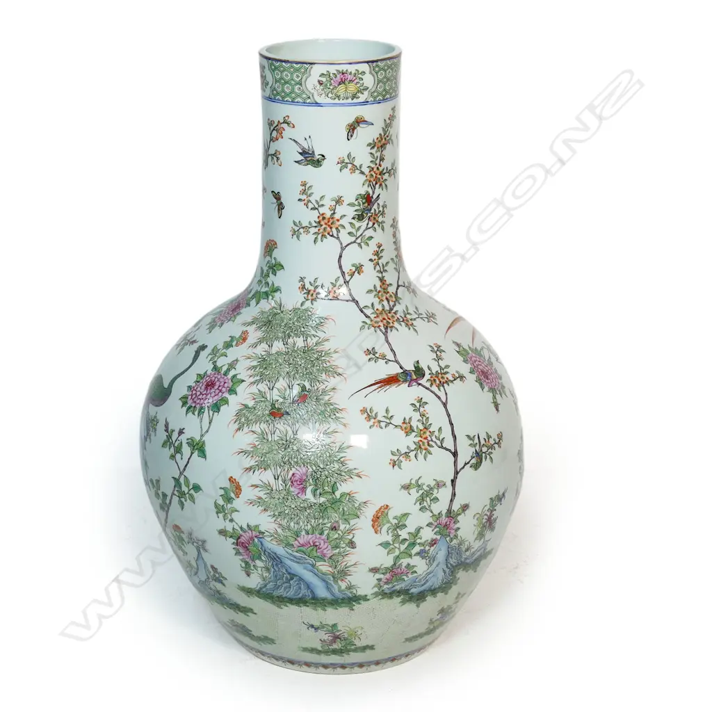 A large and impressive Chinese porcelain famille rose floor standing vase - the wide spherical body and cylindrical neck in all over famille rose decoration including birds, butterflies and florals. H.830mm. Image 1++