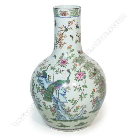 A large and impressive Chinese porcelain famille rose floor standing vase - the wide spherical body and cylindrical neck in all over famille rose decoration including birds, butterflies and florals. H.830mm.