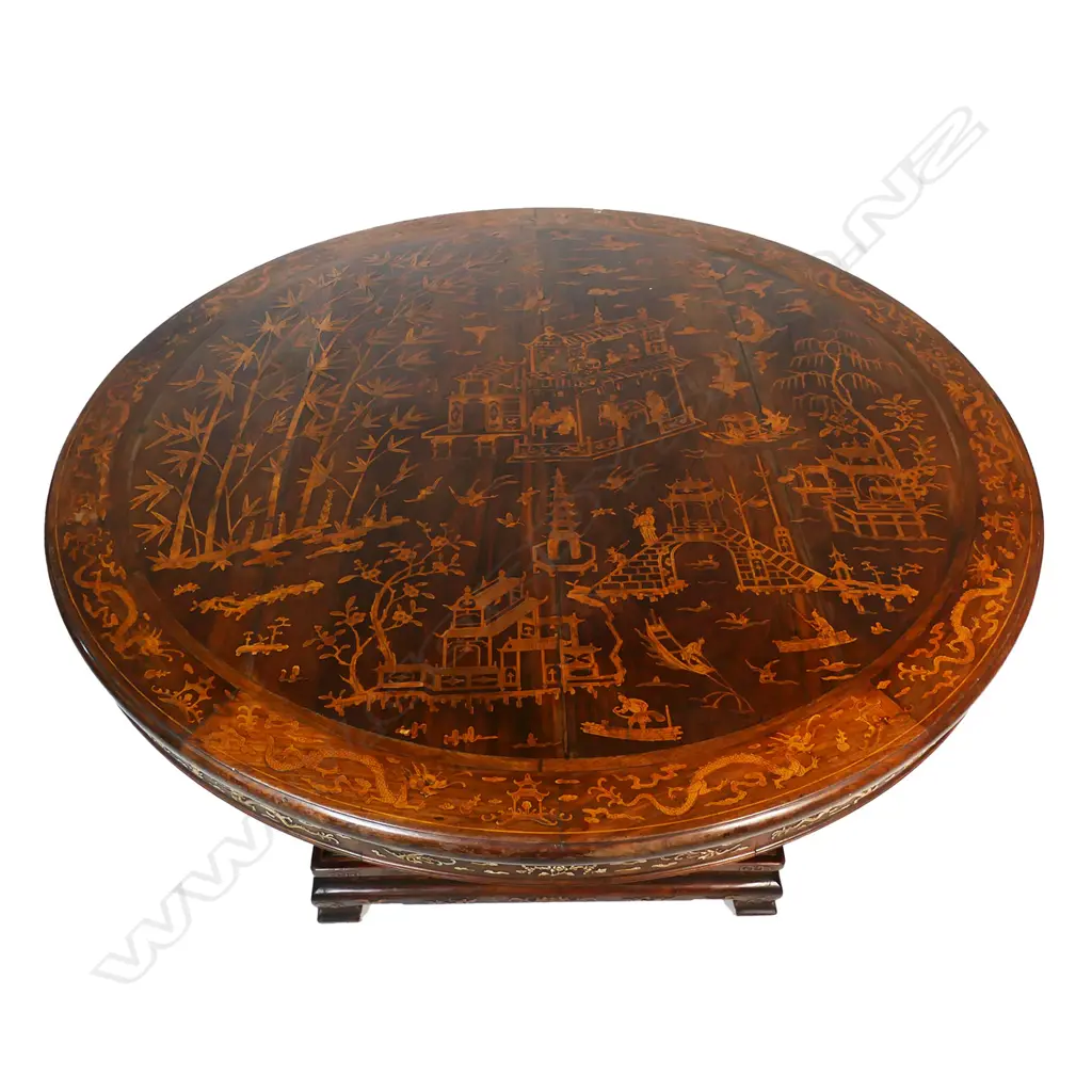 An impressive antique Chinese dining table - the round top inlaid with multiple courtyard scenes, bamboo, willow trees, clouds, phoenix birds, etc. The elaborate base with four carved substantial supports, with inlaid decoration of sacred objects on a square platform with conforming inlaid detail. 1430 x 800mm. Image 1++