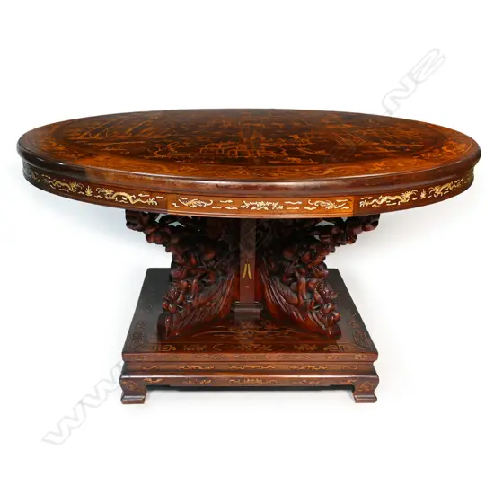An impressive antique Chinese dining table - the round top inlaid with multiple courtyard scenes, bamboo, willow trees, clouds, phoenix birds, etc. The elaborate base with four carved substantial supports, with inlaid decoration of sacred objects on a square platform with conforming inlaid detail. 1430 x 800mm.