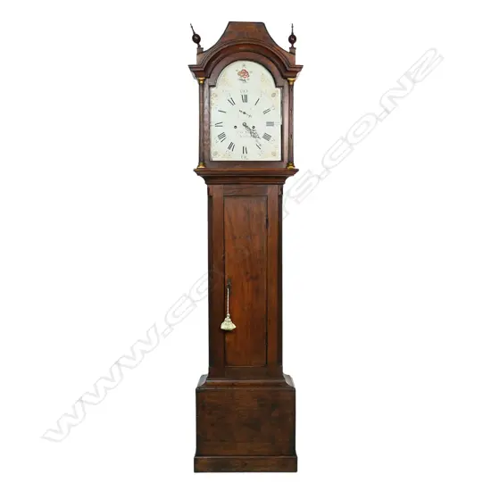A Georgian oak long case clock - the hood with two finials, (one absent), reeded column with brass detail to each side, the dial with painted floral decoration, Roman numerals with the minutes in Arabic numerals, seconds dial, marked Edwd. Maud, Daventry, chamfered sides to case. 460 x 240 x 2600mm.