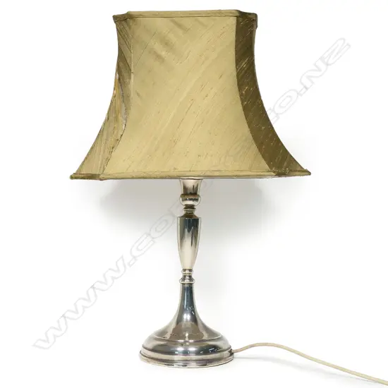 A large silver candlestick based table lamp of plain Georgian style