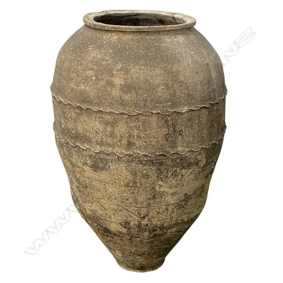 An old European terracotta tall olive oil storage jar