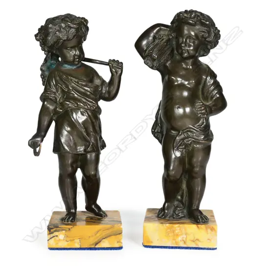A pair of bronze harvest cherubs,
