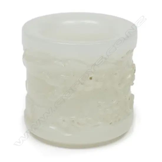 A quality Chinese carved white jade archers ring,