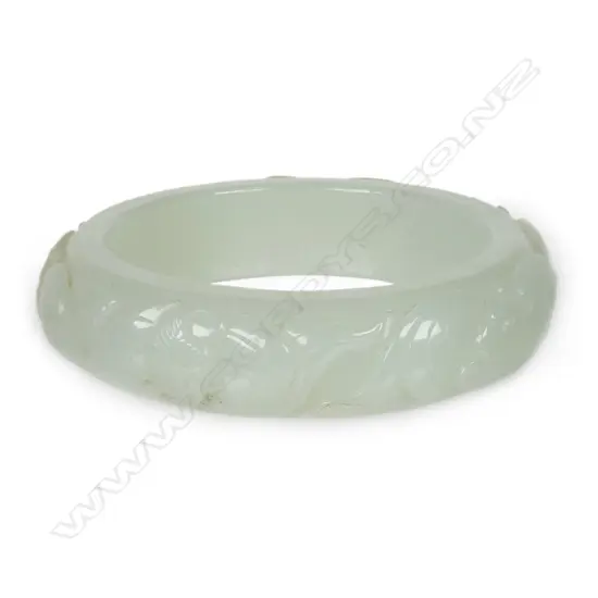 A quality Chinese carved white jade bangle,