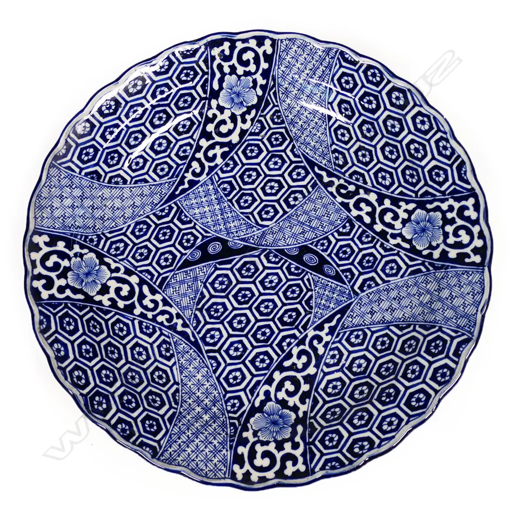 A large 19thC Japanese Meiji graphic blue and white decorated charger, Image 1++