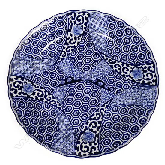 A large 19thC Japanese Meiji graphic blue and white decorated charger,