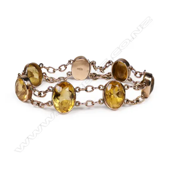 A c.1920's 9ct rose gold and six citrine bracelet,