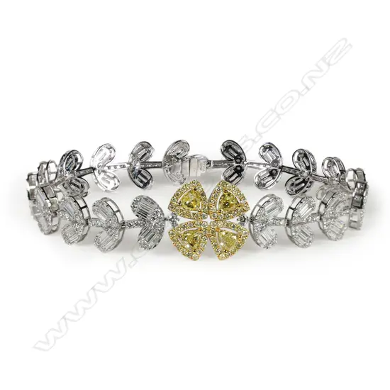 An impressive18ct white gold yellow and white diamond bracelet,