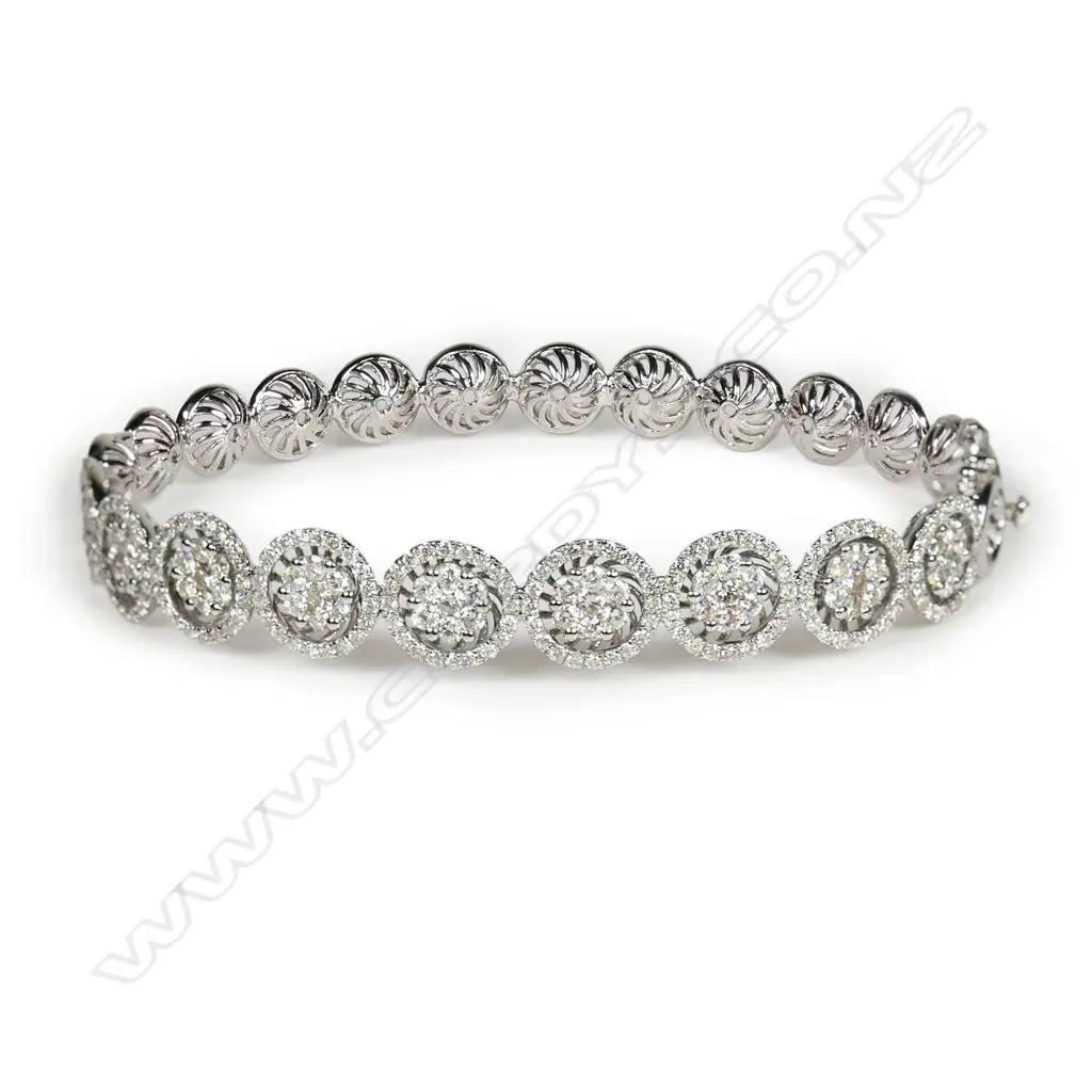 An 18ct white gold and diamond hinged bangle, Image 1++