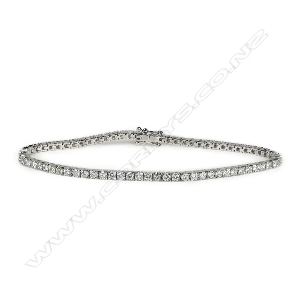 An 18ct white gold and diamond tennis bracelet, Image 1++