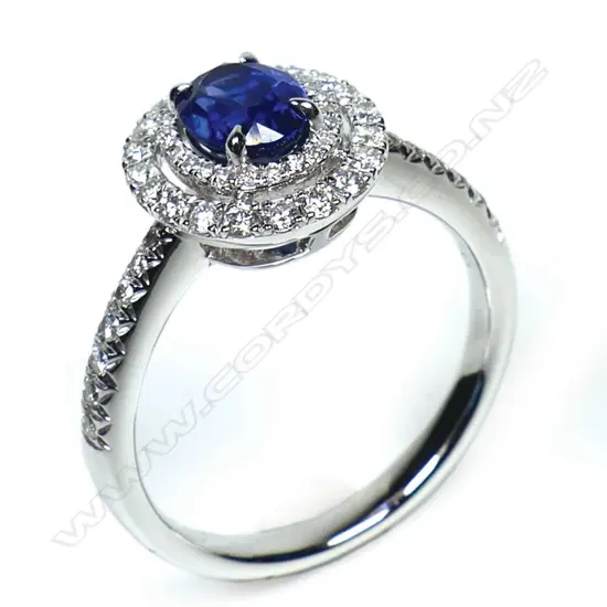 An 18ct white gold sapphire and diamond double halo ring,